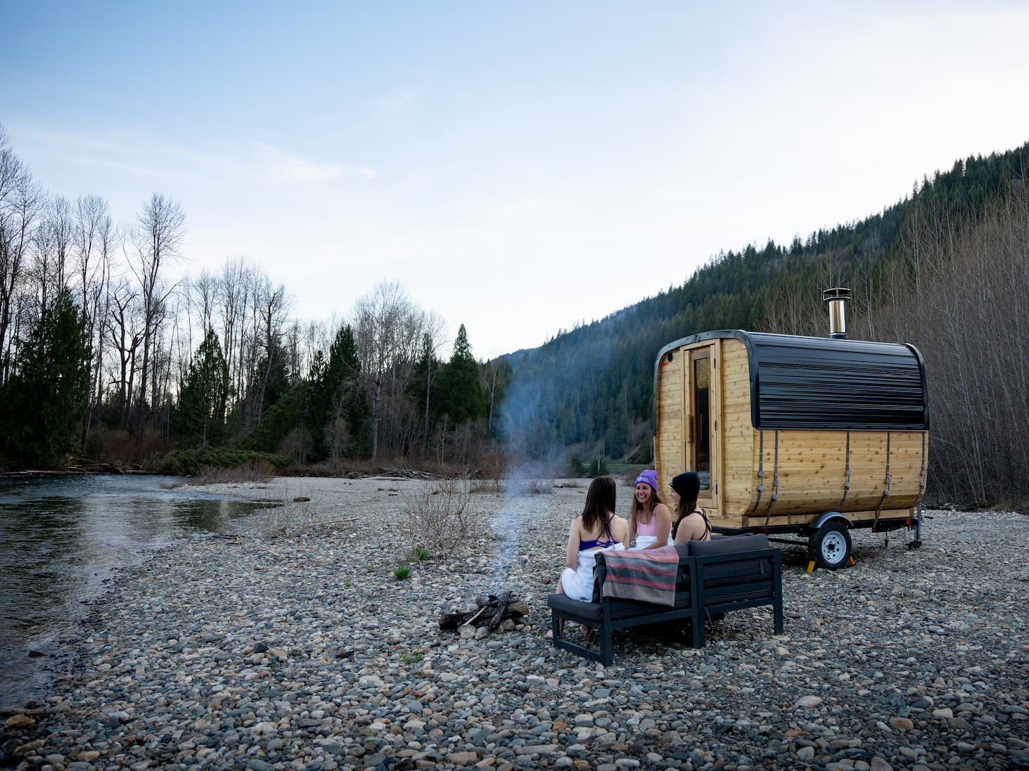Sauna interior with wood stove and bench seating